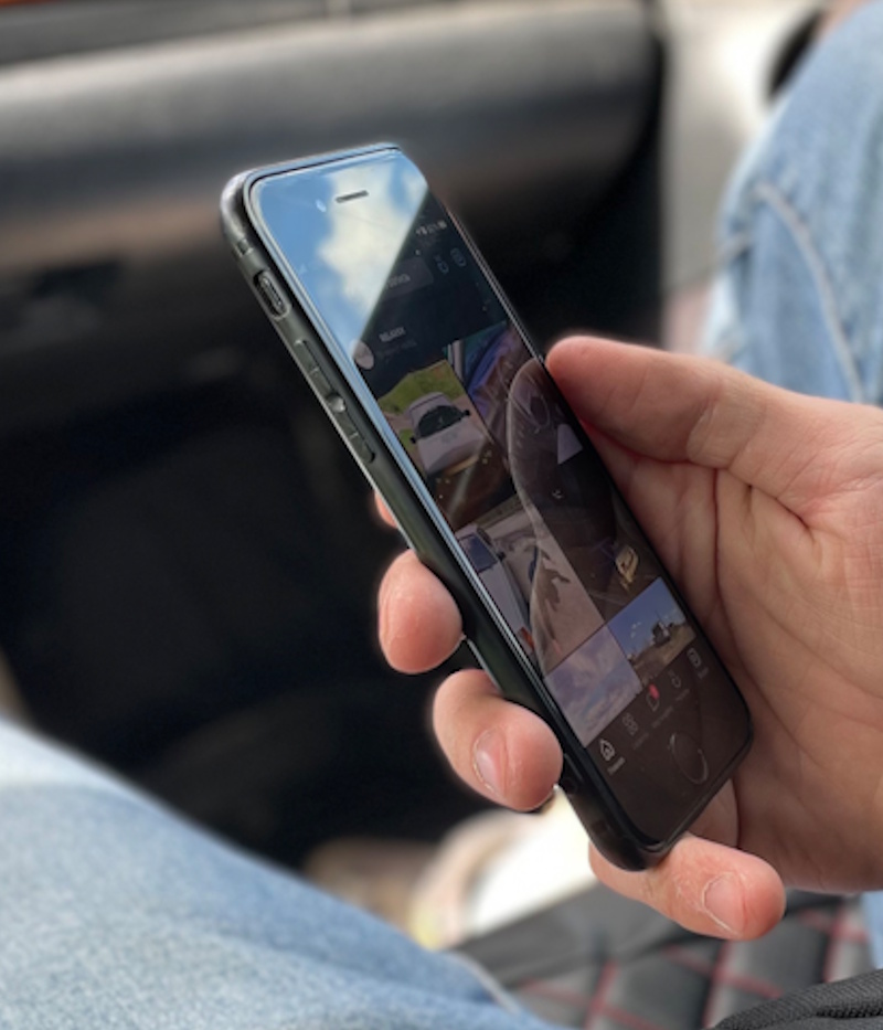 phone-addiction-hypnotherapy hand searches the Internet for an illegal site